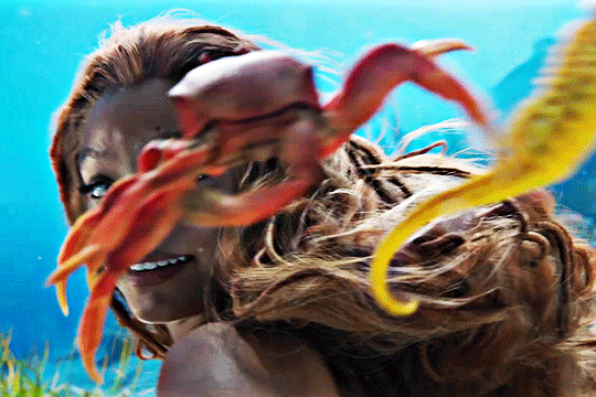 The Little Mermaid live action, Halle Bailey giggles at Sebastian The Crab.