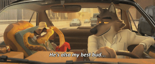 Gifset of Snake and Wolf from The Bad Guys. Snake is cracking a safe in the passenger seat, while Wolf drives. Wolf says "he's also my best bud."
