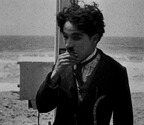 chaplinfortheages:  The beautiful Pacific Ocean churning in the background. Charlie Chaplin shot this Essanay short film “By the Sea" in April 1915, Crystal Pier, Los Angeles.  A LIL BIT CRAZY