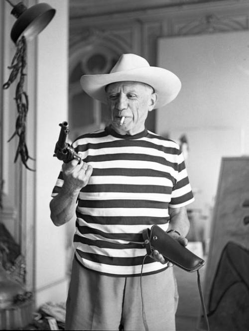 Pablo Picasso with Gary Cooper’s gun and hat by André Villers 1958 