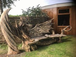 archiemcphee: Sitting outside on a bench and relaxing is great. But sitting on a bench carved to look like a fierce dragon is awesome! Estonian artist Igor Loskutov carved this fantastic dragon bench using a chainsaw. Currently based in Bad Dürrheim,