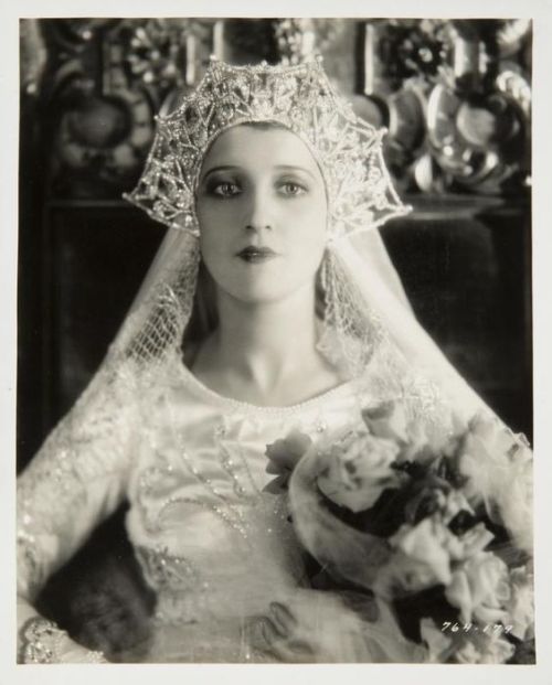 An ivory silk satin wedding gown worn by Jeanette MacDonald in her debut film role as Queen Louise i