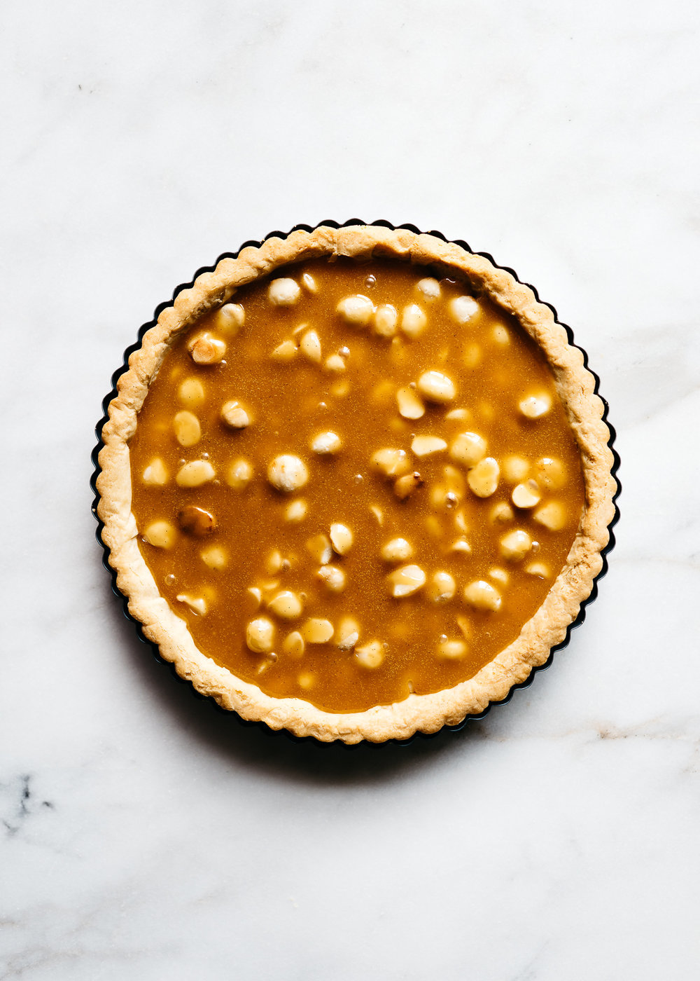 sweetoothgirl:    CHOCOLATE-CARAMEL MACADAMIA NUT TART    Uh&hellip;YES PLEASE!