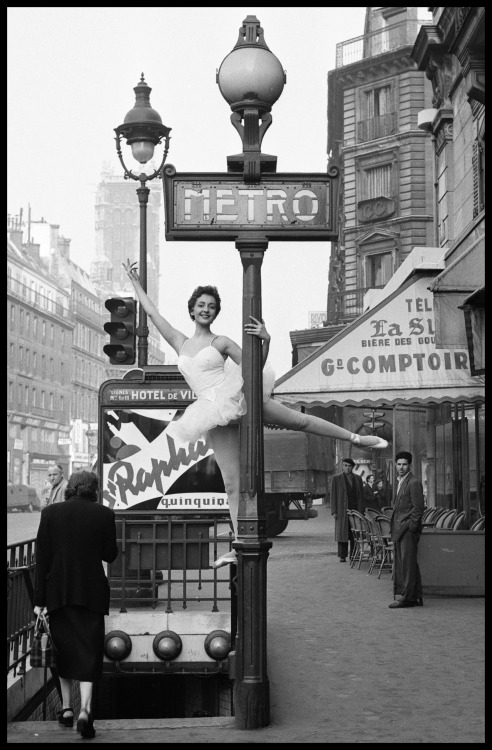 Ballerina Christianne Gaulthier, a dancer at the Moulin Rouge, poses outside the Hotel de Ville metr