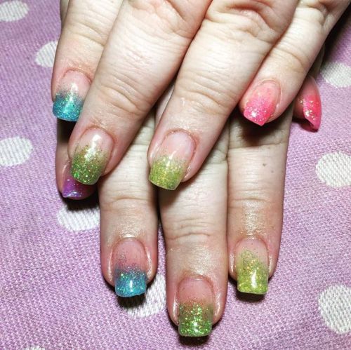 Glittery pride nails for my wife! Found some neon glitter at the craft store this weekend, and here 