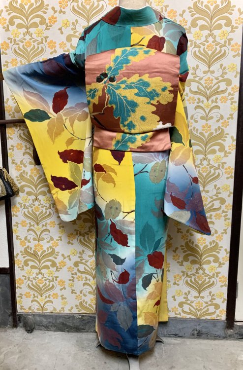 Vintage outfit looking like a bright Autumn day, featuring colorful leaves kimono, paired with a mat