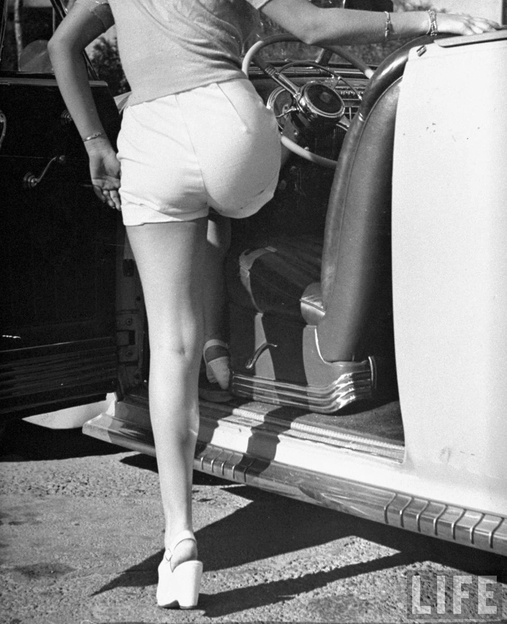 starsensuelles:  Walter Sanders - Betty Grable’s famous legs as she models white