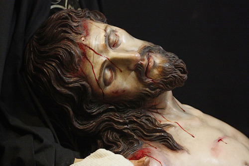 catholicsoul:Today a tomb holds Him who holds the creation in the hollow of His hand; a stone covers