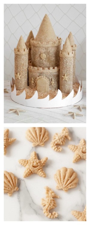 DIY Sandcastle CakeFunfetti cake mixes were used for the structure of the cake, topped with a butter