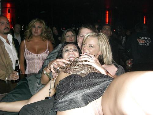 carelessnaked: Showing her pussy in a short skirt while playing with her friend in the bar