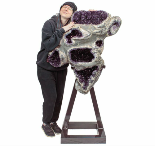 This is a one-of-a-kind, jaw dropping, dark amethyst crystal geode on a large custom metal stand. Th