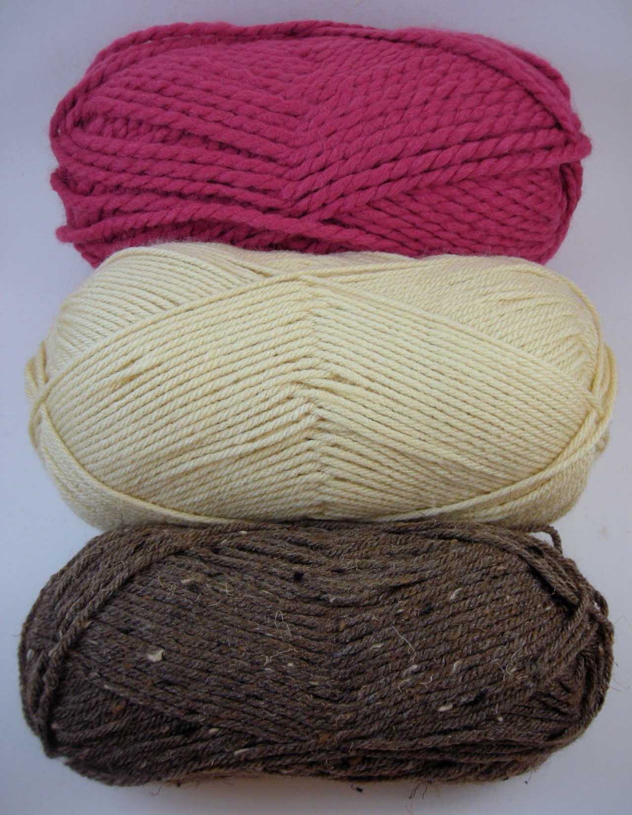 “Don’t buy any more yarn,” I told myself, “I have way too much yarn.”
(An overflowing basket full!) But I had a really good coupon, okay?
Once I had them home I realized they look like neapolitan ice cream!