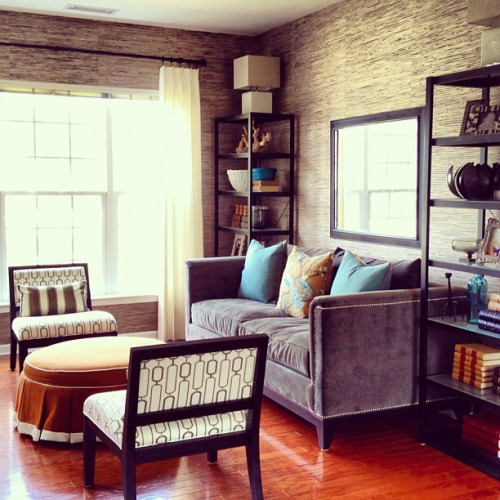 designmeetstyle:  Savvy space. Get the storage you need and the look you want by using shelving as your end tables. They frame the room and let you take advantage of the wall space to display family photos, art, personal mementos and this week’s favorite