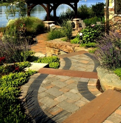 Inspiration For A Mid-sized Coastal Full Sun Backyard Brick Landscaping.