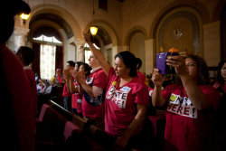 mehreenkasana:  Los Angeles Raises Minimum Wage to ฟ an Hour.Photo: Maria Castañeda, a Unite Here union member, raised a fist Tuesday during a City Council meeting in Los Angeles before a vote to raise the city’s minimum wage.