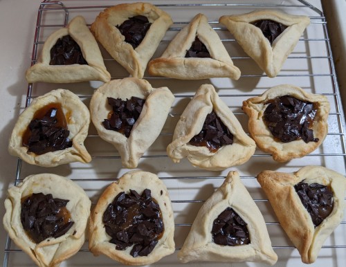 Hamantaschen! The quality is variable but the flavor is fine! These were made with the cookie recipe