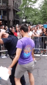buzzfeed: A Hot Cop Got Down At NY Pride The purple-shirted dancer, Aaron Santis,