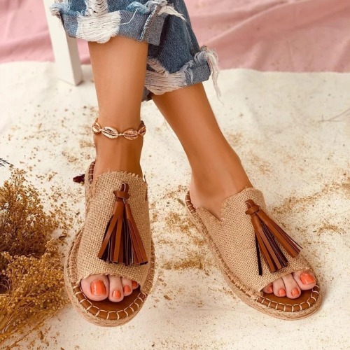 Unique peep toe sandals with a leather fringe.