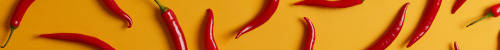 Divider image featuring red chili peppers on a yellow background.