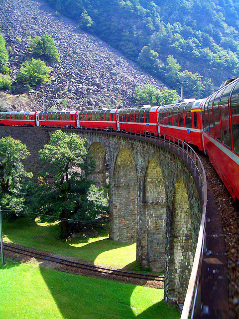  Bernina train on Brusio viaduct in Graubünden, Switzerland (by stack1960). 