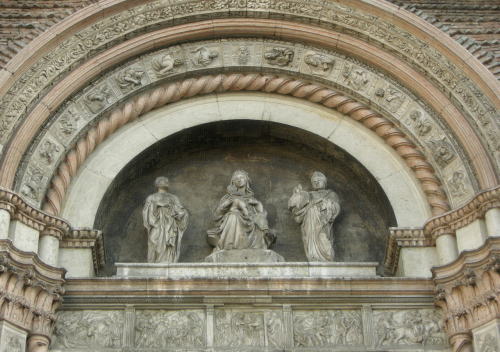  Tympanum of the main doorway (Porta Magna) of San Petronio, Bologna, with  Madonna and Child, Saint