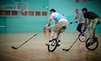 snippetzofstuff:  Unicycle hockey… its a real thing. One team even dress like penguins… on unicycles