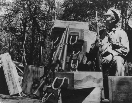 Bolivian solder guarding a stash of vz. 24 rifles, Chaco War, 1932-1935