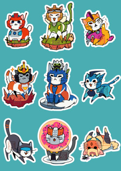 coralus:  KITTYFORMERS STICKERS!!! available at my table! :Dmight make more before my flight–