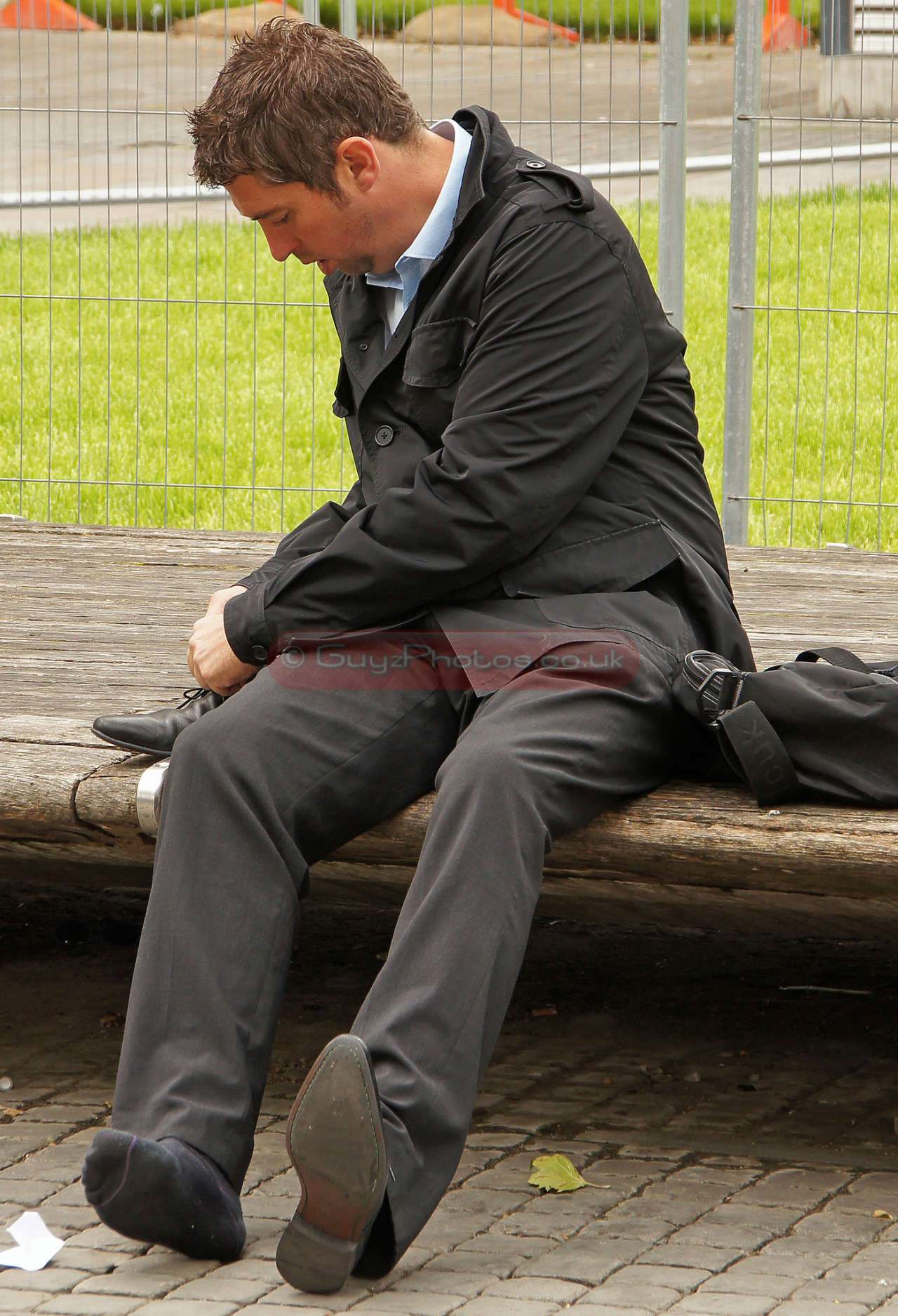malesoxlover:  man took off his shoesperhaps there was stone or sands in his shoe