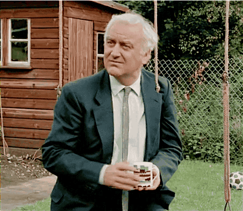 britishdetectives: Inspector Morse. On a swing set. Smiling. 