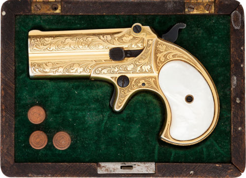 Cased, engraved, and gold plated .41 rimfire Remington derringer.  Also includes pearl grips.  Circa