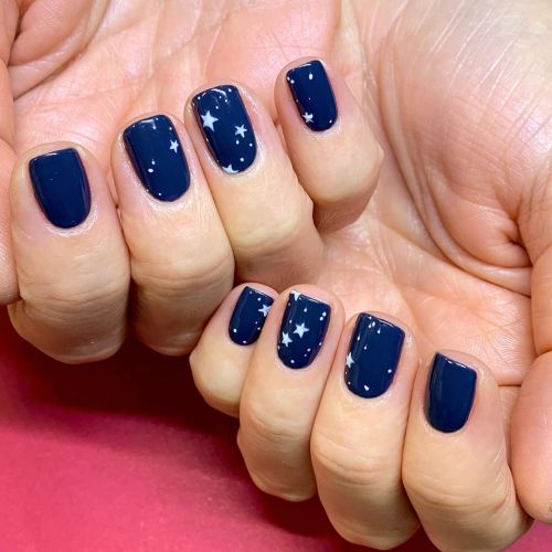 A small sprinkling of stars for Jessica over a beautiful and rich navy base. Handpainted with Shella
