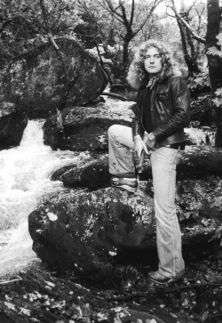 babeimgonnaleaveu:  Robert Plant photographed by Terry Spencer in Wales, 1976.   I love you Robert but what&rsquo;s with those shoes, and why are u holding a stick at crotch level?