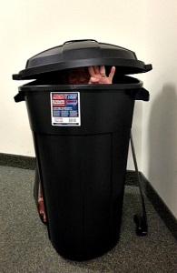 The Signs as people in trash cans