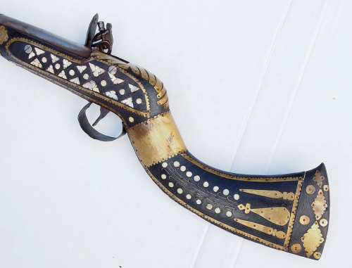 Ornate brass and pearl mounted flintlock jezail, Afghanistan, 19th century.from Kabul Art Gallery