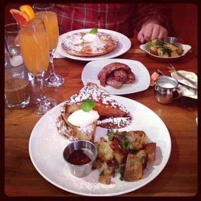 sunday brunch at rustic roots (featuring grapefruit/orange mimosa, french toast with whipped cream and salted caramel sauce, apple spice pancakes, tarragon potatoes, and house-made coffee maple sausage)