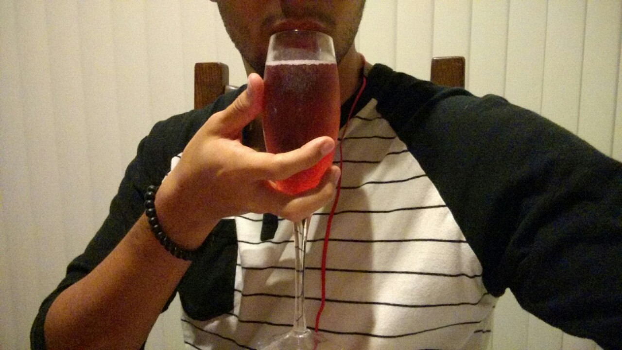 Me last night celebrating a personal victory with a glass of pink champagne after