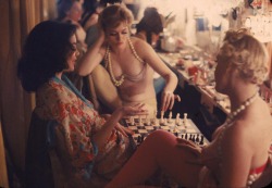 20thcenturypix:  Showgirls play chess between