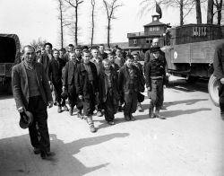 soldiers-of-war:  GERMANY. Near Weimar. April 1945. Children and other prisoners liberated by the 3rd U.S. Army from the Buchenwald concentration camp. The freed prisoners are walking to an American hospital to receive treatment. The tall youth in line