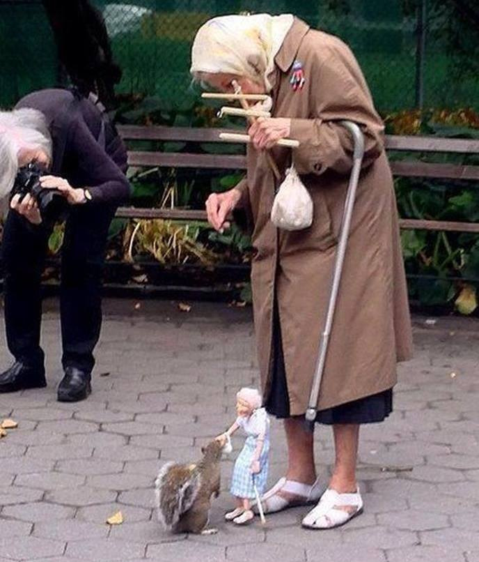 awwww-cute:  Old woman uses a marionette of herself to feed squirrels in the park