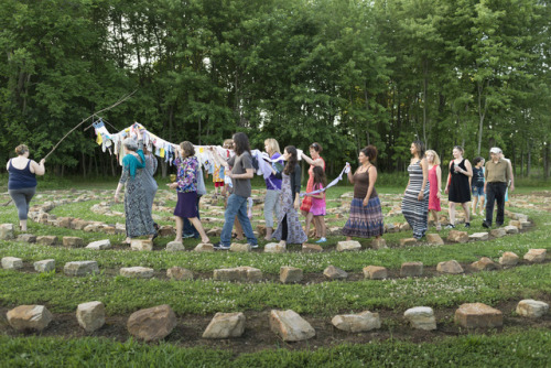 Mandala Gardens,  Releasing the dreams performance ritual with  the Diversity Dream Scroll with students, faculty and friends. Photo credit Gregory Wendt