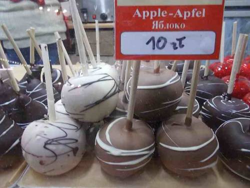 Fruits in chocolate offered for sale during Christmas market in the city Wroclaw, Poland.