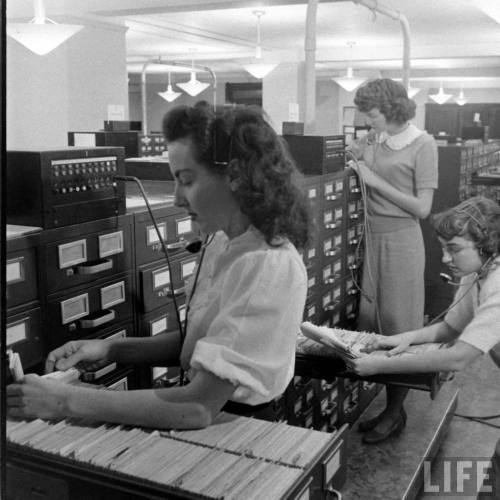 Plugged-in clerks checking the Bank of America files(J.R. Eyerman. 1949)