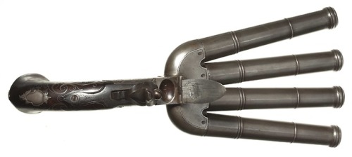 Four barreled flintlock pistol crafted by T. Richards of Birmingham, England, circa 1800.from Herman