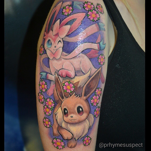 best-gaming-tattoos:  Amazing Sylveon &amp; Eevee tattoo done by @prhymesuspect.