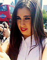 5harmonism:  Lauren climbing on a wall to greet fans and take pictures with them