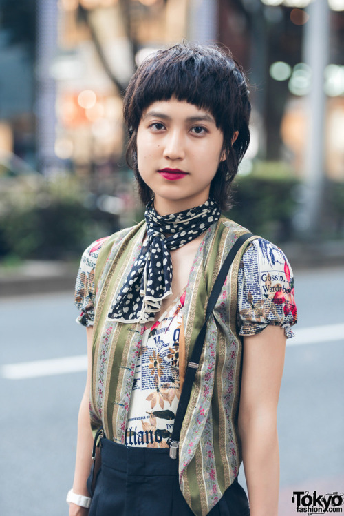 tokyo-fashion:  19-year-old Asako on the street in Harajuku wearing a graphic top by John Galliano with cropped pants, heeled boots, suspenders, and a wicker purse. Full Look