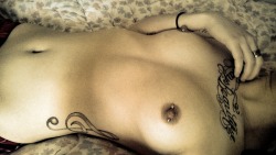 megancollectscats:  I’ve been kinda iffy about posting this. but everyone has breasts, and I kinda really adore my nipple piercings.. This shall be the one and only picture I’ll ever post of myself in such a sensual way.