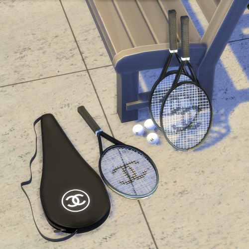 | Chanel Tennis Clutter | Set Contains:• Flat Tennis Racket (Single)• 2 Leaning Tennis Rackets• Rack