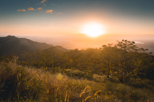 Mount Parawagan, Montalban, PhilippinesWatching the world bathe in golden sunlight.www.worktravelsho